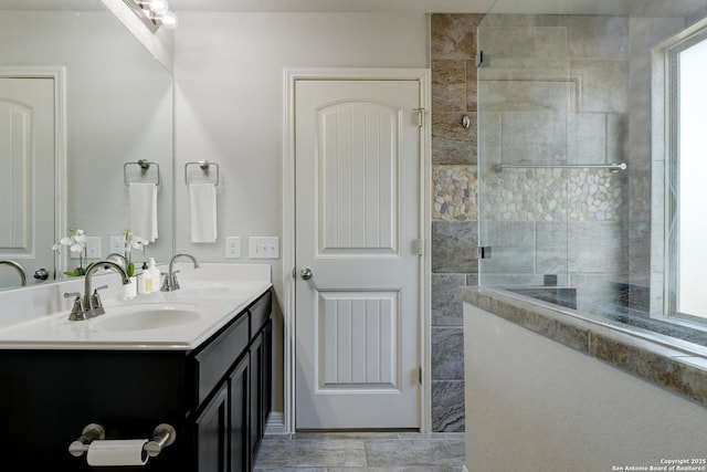 bathroom with vanity and a wealth of natural light