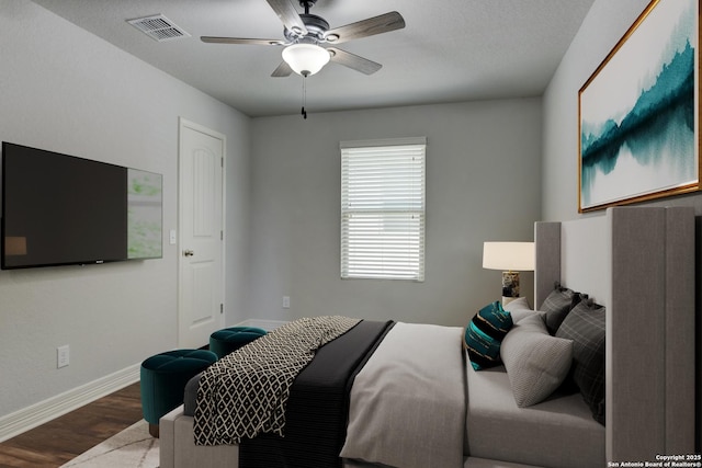 bedroom featuring ceiling fan and hardwood / wood-style floors