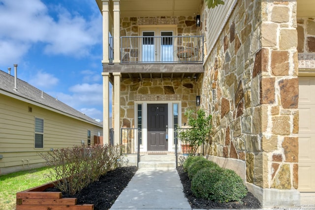 entrance to property with a balcony