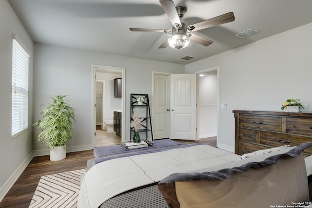 bedroom with ensuite bathroom, hardwood / wood-style floors, and ceiling fan