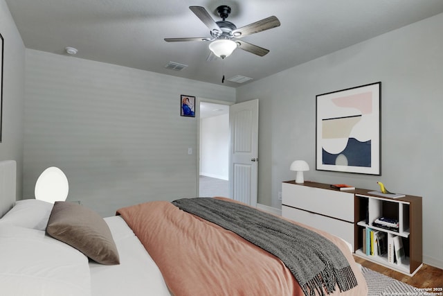 bedroom with wood-type flooring and ceiling fan