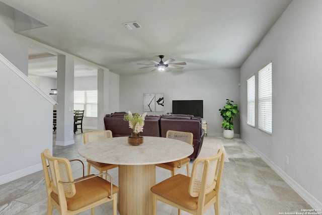 dining space featuring plenty of natural light and ceiling fan