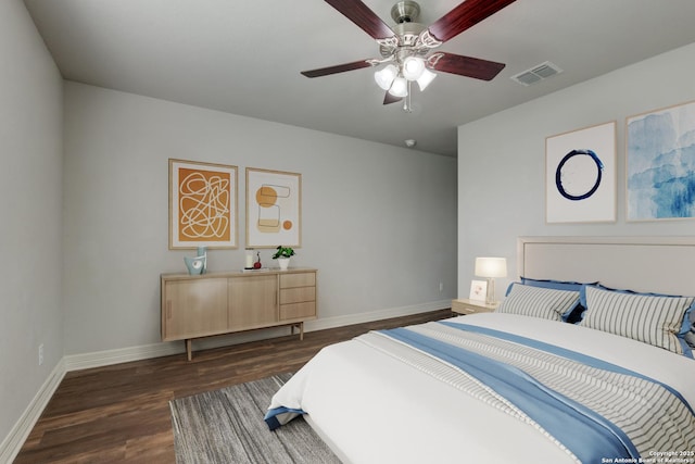 bedroom featuring dark hardwood / wood-style flooring and ceiling fan