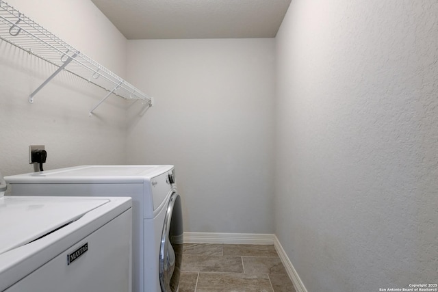 washroom featuring washer and dryer