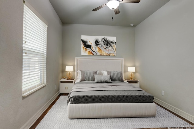 bedroom featuring hardwood / wood-style flooring and ceiling fan