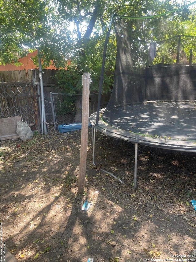 view of yard featuring a trampoline