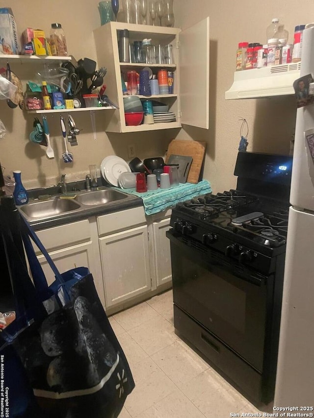 kitchen with sink, black range with gas stovetop, and light tile patterned floors