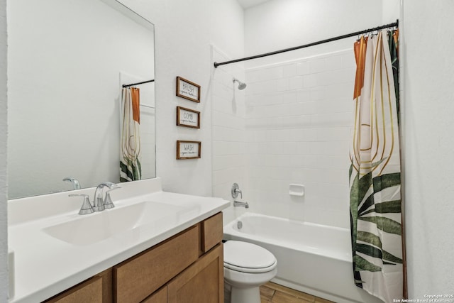 full bath with vanity, toilet, and shower / bath combo with shower curtain