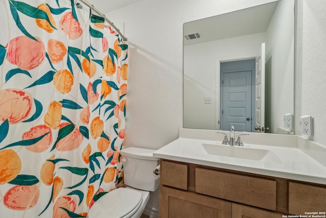 bathroom with toilet, a shower with shower curtain, vanity, and visible vents