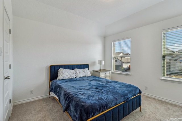 bedroom with carpet flooring and baseboards