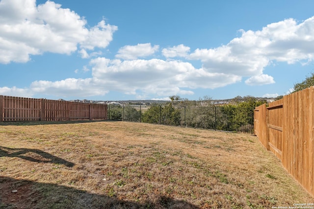 view of yard featuring a fenced backyard