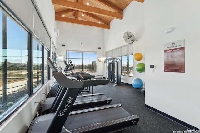 workout area with high vaulted ceiling, wooden ceiling, and baseboards