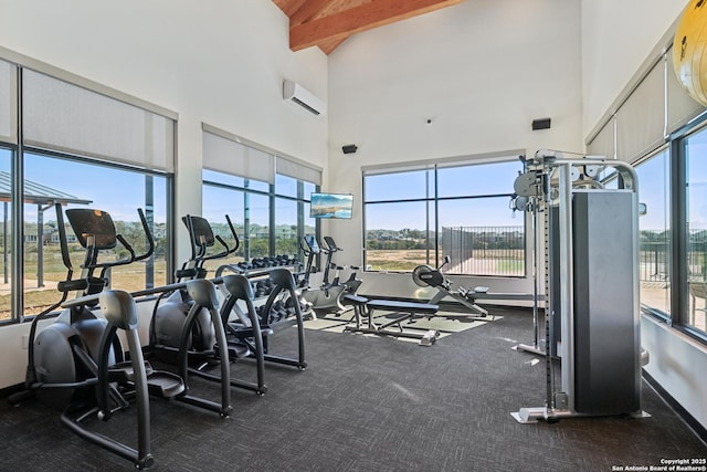 gym featuring high vaulted ceiling, a wall unit AC, and baseboards