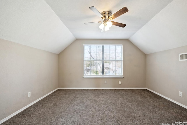 bonus room with lofted ceiling, carpet floors, and ceiling fan