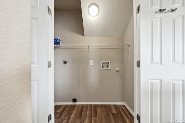 laundry area featuring dark wood-type flooring, gas dryer hookup, a textured ceiling, washer hookup, and hookup for an electric dryer