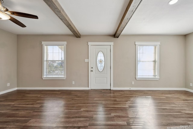 foyer featuring ceiling fan, dark hardwood / wood-style floors, and beam ceiling