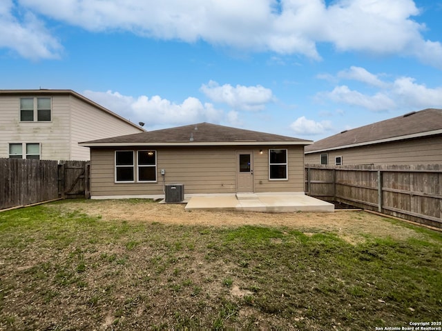 rear view of house featuring a patio and a yard