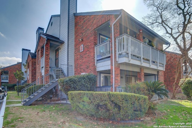 view of home's exterior with a balcony