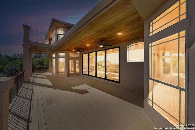 deck at dusk with ceiling fan