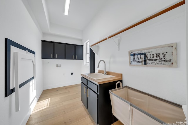 kitchen with light hardwood / wood-style floors and sink