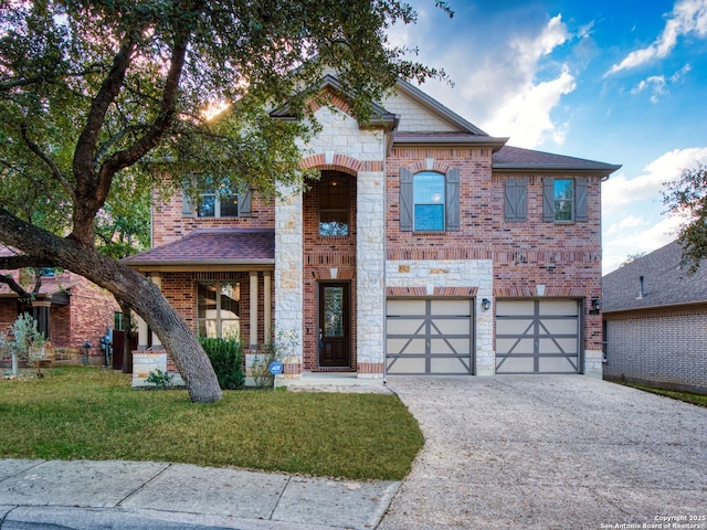 view of front of house featuring a garage and a front yard