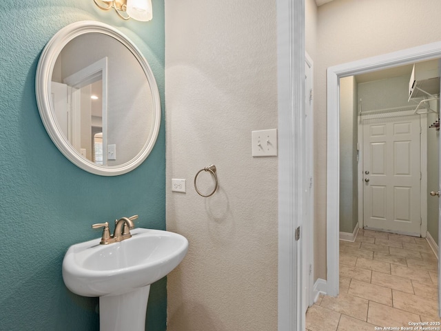 bathroom with sink and tile patterned floors