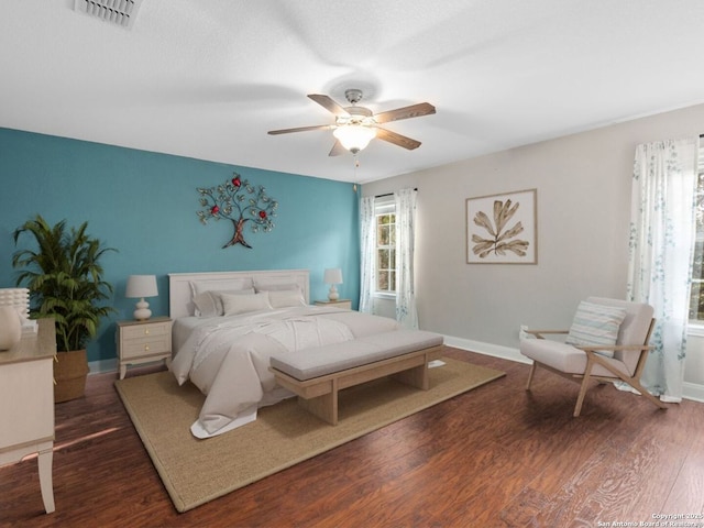 bedroom featuring dark wood-type flooring and ceiling fan