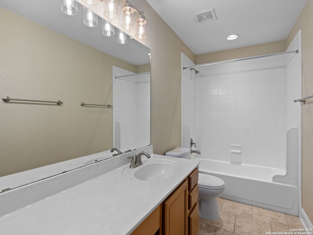 full bathroom featuring vanity, tiled shower / bath combo, and toilet