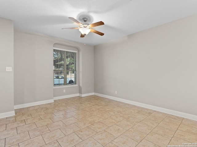 spare room featuring ceiling fan