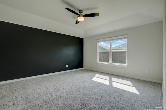 empty room with ceiling fan and carpet