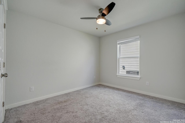 spare room with carpet and ceiling fan