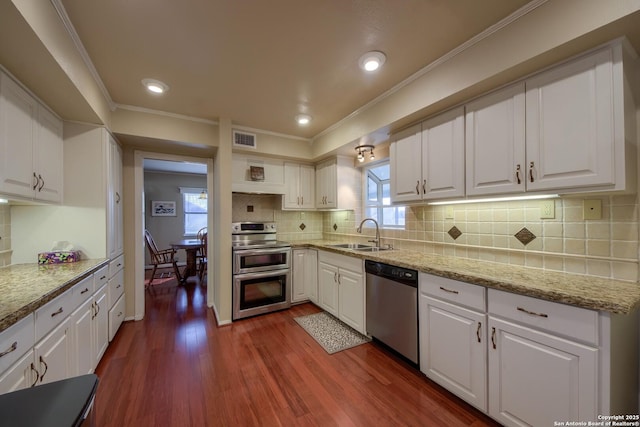 kitchen with white cabinetry, sink, and appliances with stainless steel finishes