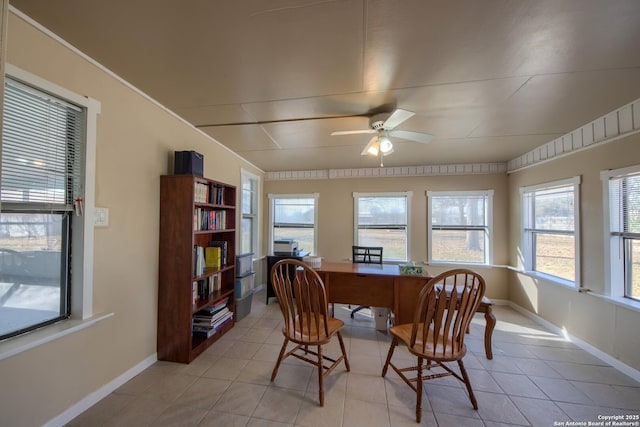 tiled dining space featuring ceiling fan