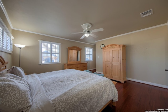 bedroom featuring dark hardwood / wood-style flooring, crown molding, and ceiling fan