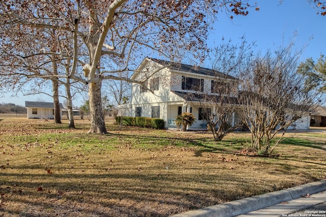 front facade with a front yard