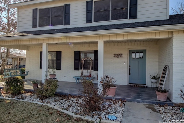 doorway to property featuring a porch