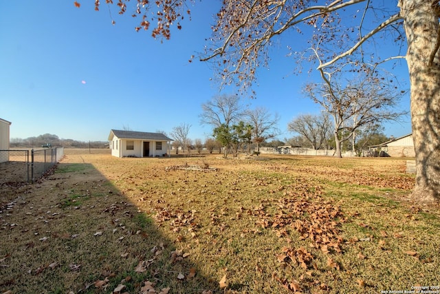 view of yard featuring an outbuilding and a rural view