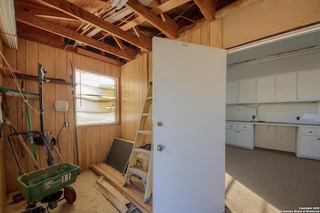 misc room with wooden walls