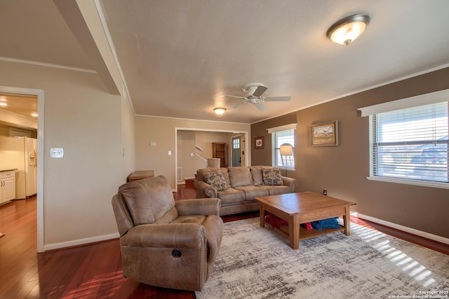 living room featuring hardwood / wood-style flooring, ornamental molding, and ceiling fan