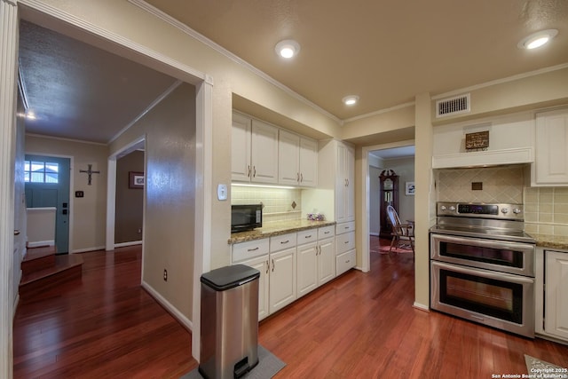 kitchen featuring crown molding, double oven range, dark hardwood / wood-style floors, and white cabinets