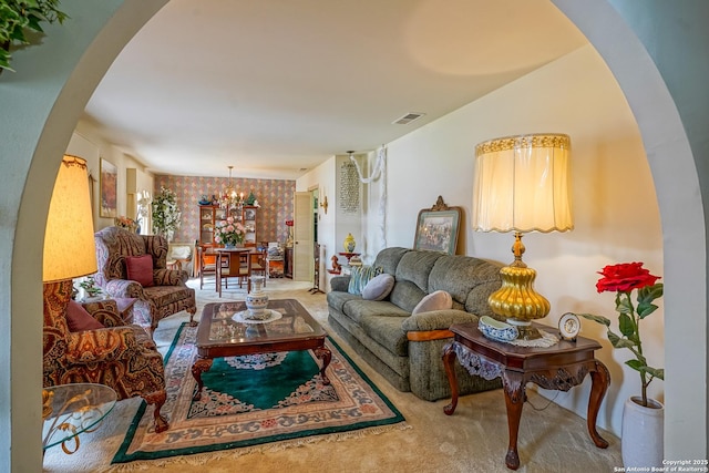 living room with an inviting chandelier