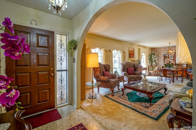 foyer entrance featuring a notable chandelier