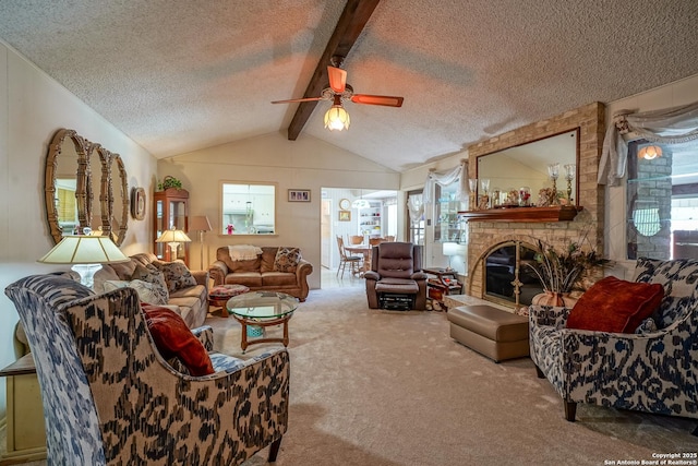 living room with plenty of natural light, lofted ceiling with beams, and carpet