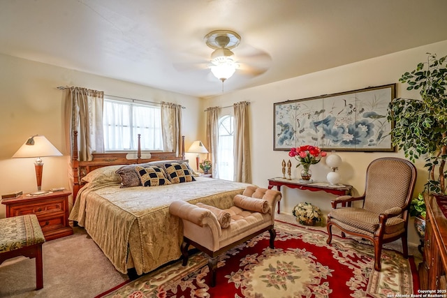 bedroom featuring ceiling fan and light carpet