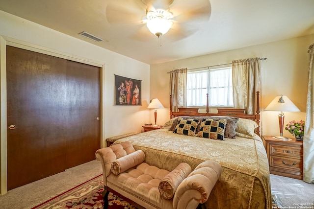 carpeted bedroom with a closet and ceiling fan