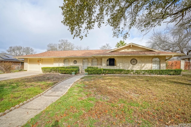 ranch-style house with a garage and a front yard