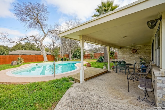 view of swimming pool featuring a patio area