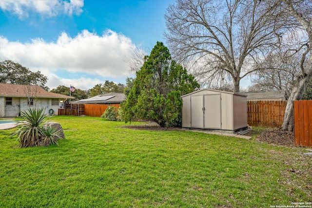 view of yard with a storage unit