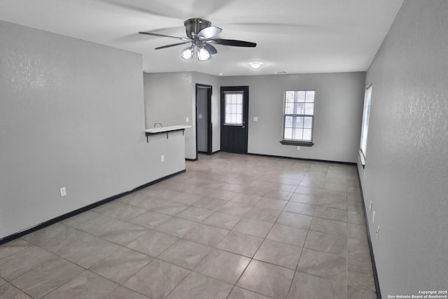 unfurnished room featuring ceiling fan