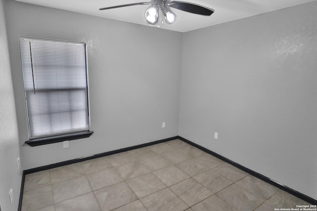 spare room with ceiling fan